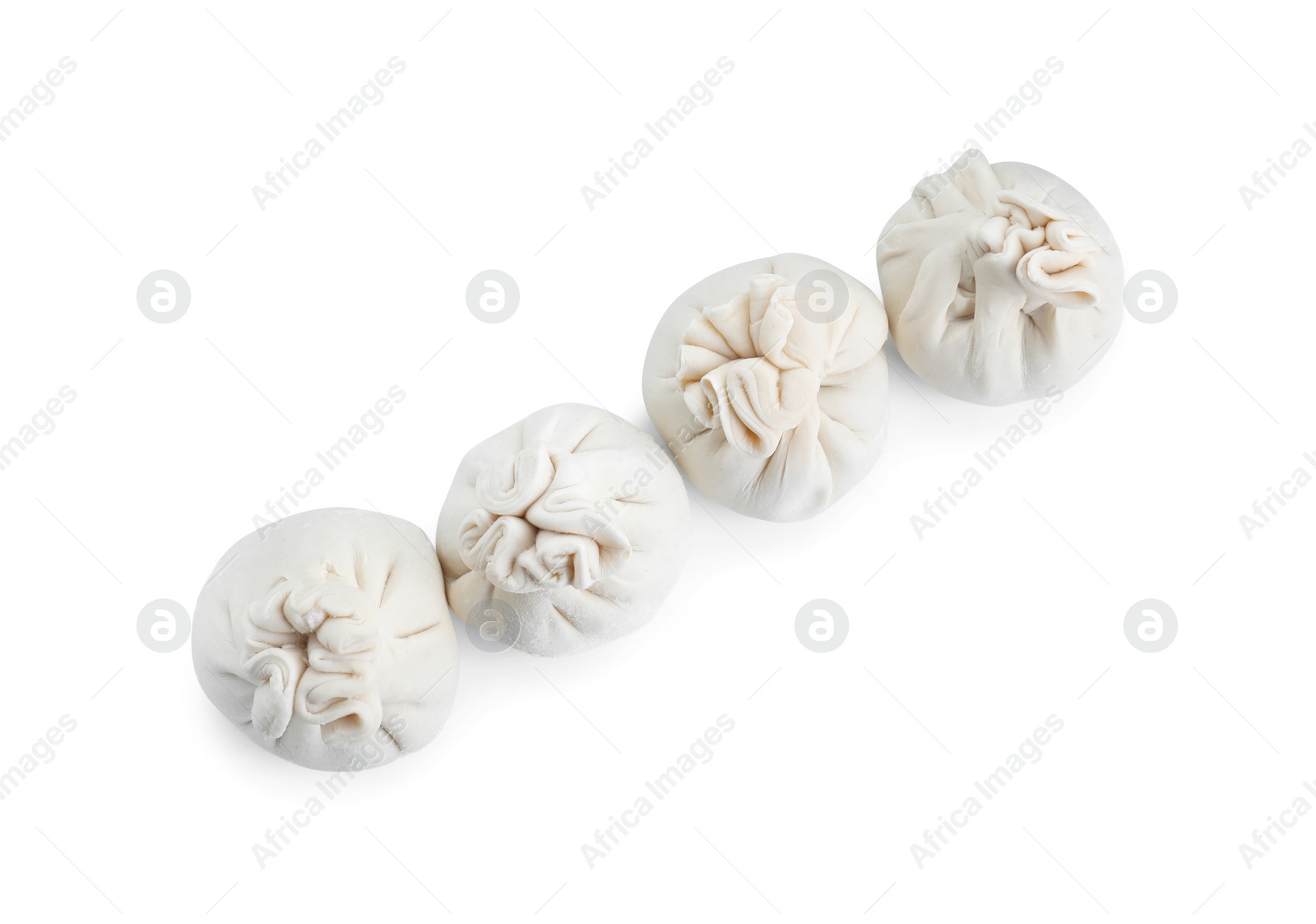 Photo of Uncooked khinkali (dumplings) isolated on white, top view. Georgian cuisine