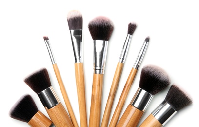 Makeup brushes of professional artist on white background