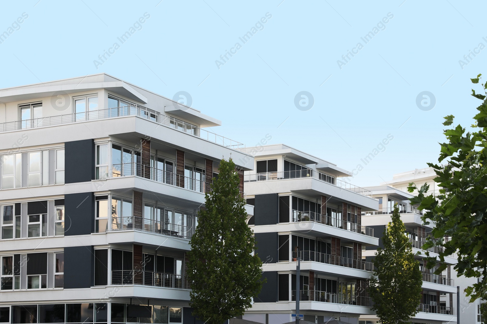 Photo of Beautiful view of modern buildings with big windows outdoors