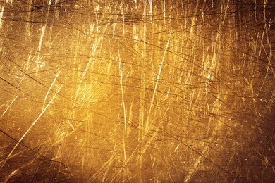 Image of Golden textured surface as background, closeup view