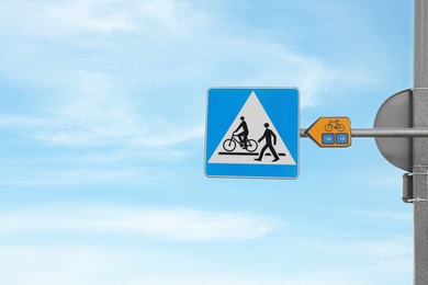 Photo of Traffic sign Pedestrian and Cyclist Crossing outdoors on sunny day, space for text