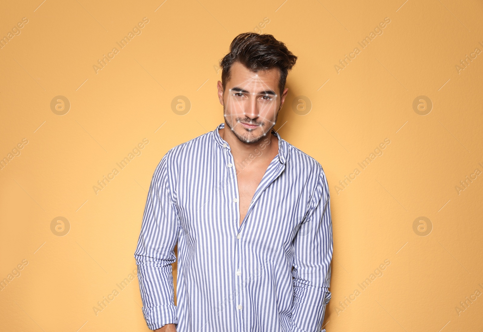 Image of Facial recognition system. Young man with digital biometric grid on yellow background