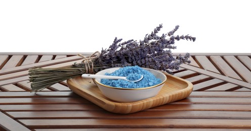 Photo of Bowl with blue sea salt and lavender flowers on wooden table against white background