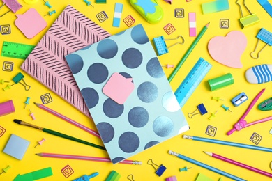 Photo of Flat lay composition with different school stationery on color background