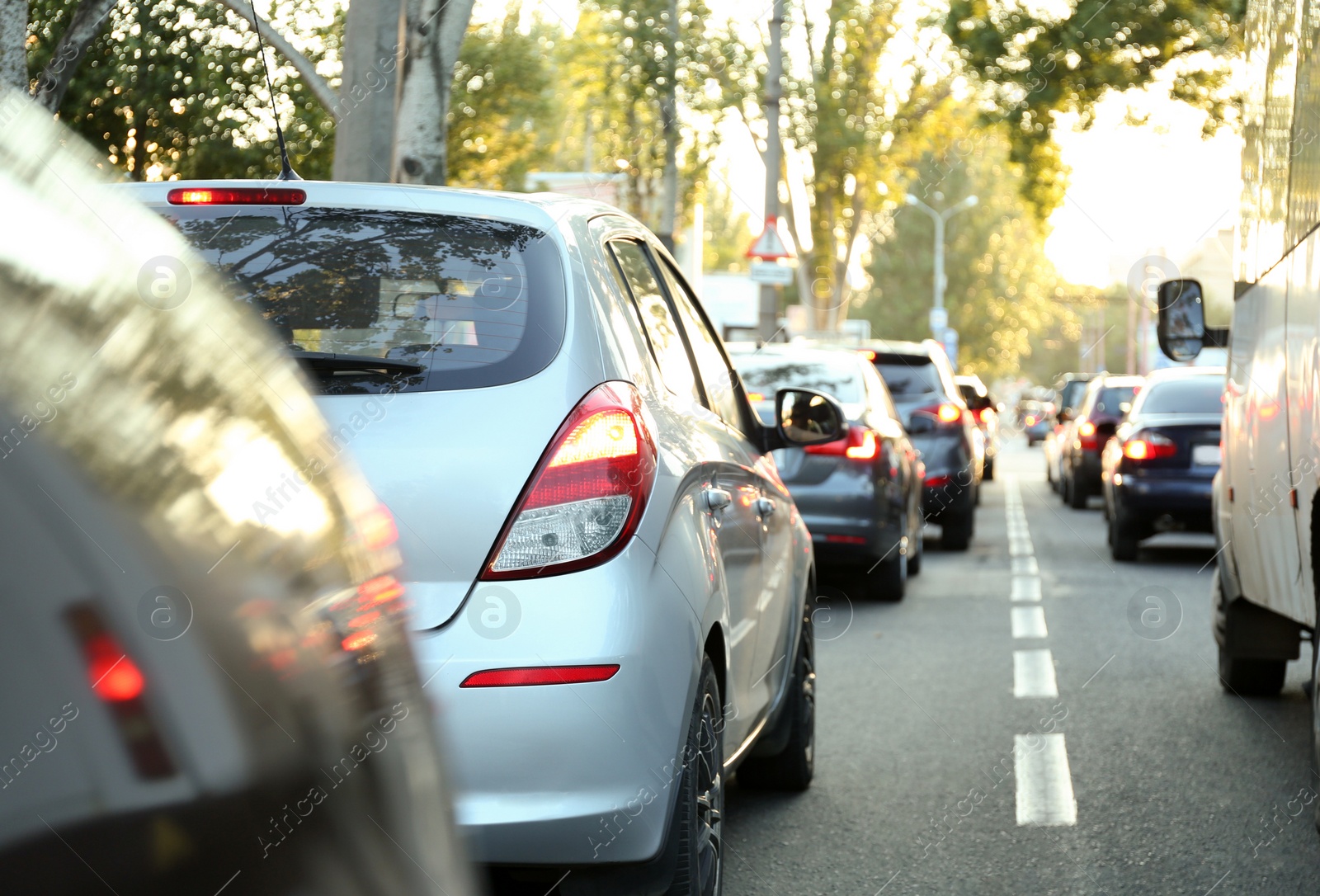 Photo of Cars in traffic jam on city street, closeup