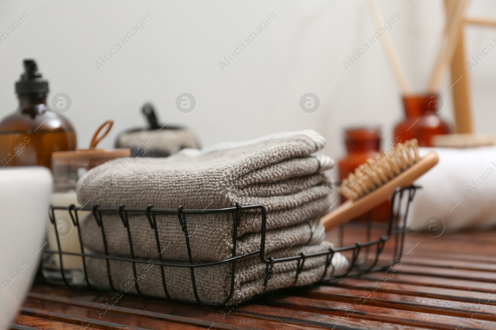 Photo of Personal hygiene products on wooden table in bathroom