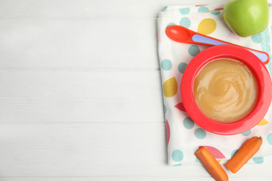 Photo of Flat lay composition with healthy baby food and ingredients on white wooden table. Space for text