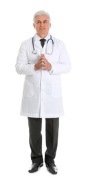 Photo of Full length portrait of male doctor with stethoscope isolated on white. Medical staff