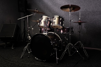 Photo of Modern drum set in recording studio. Music equipment