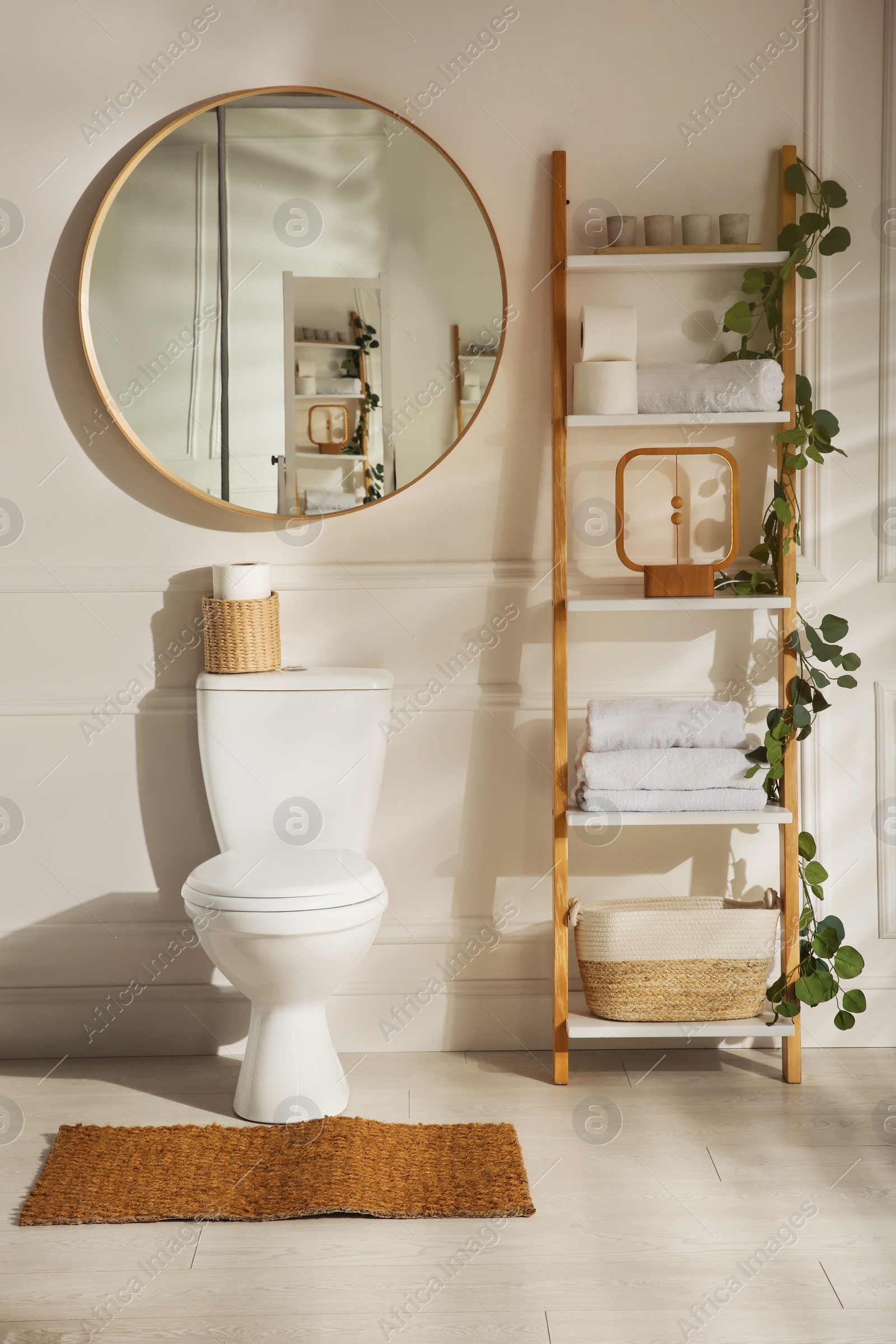 Photo of Modern toilet bowl in comfortable restroom. Interior design