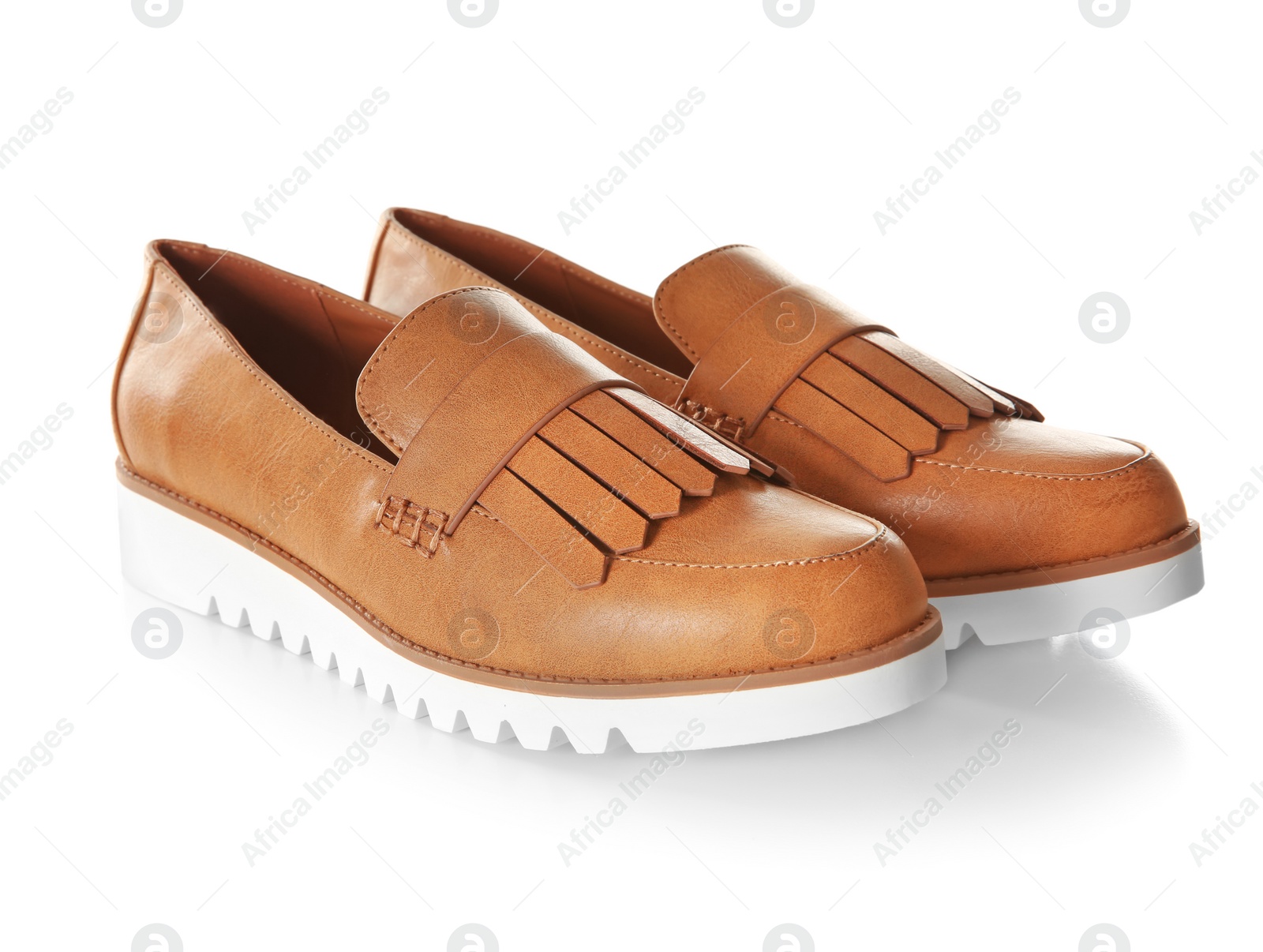 Photo of Pair of female shoes on white background