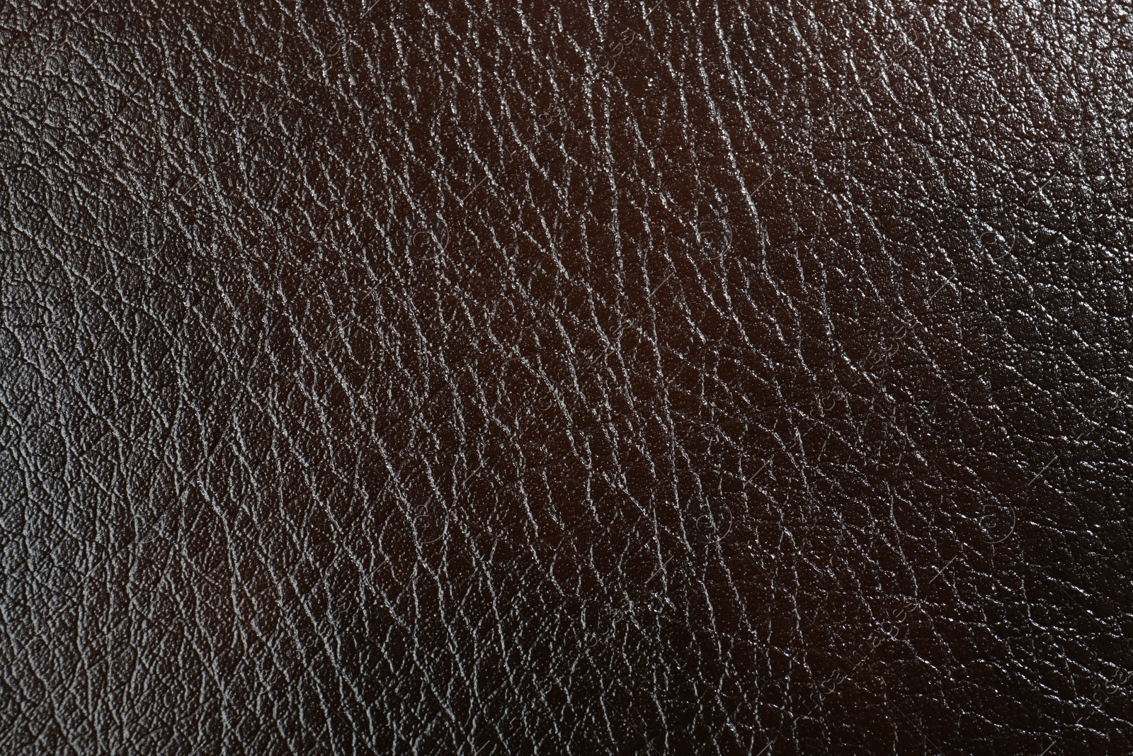 Photo of Texture of brown leather as background, top view