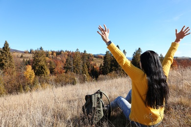 Female traveler feeling free in peaceful mountains