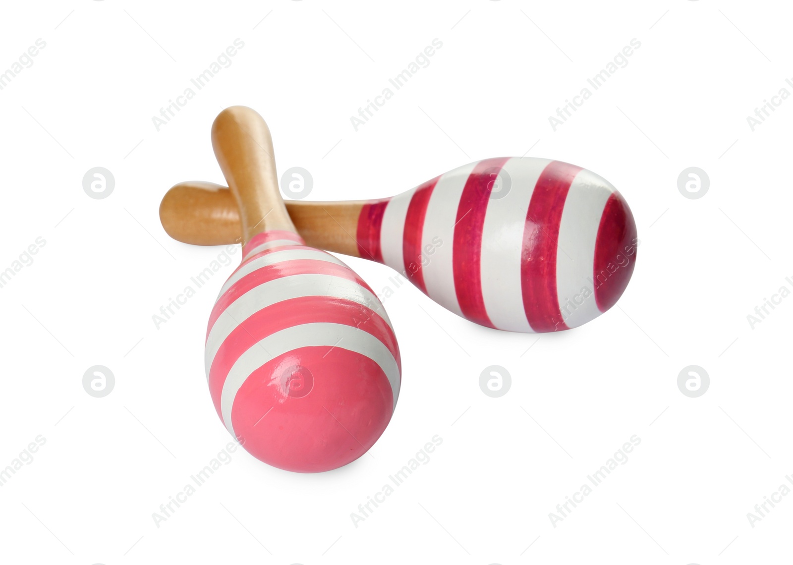 Photo of Two wooden maracas isolated on white. Children's toy