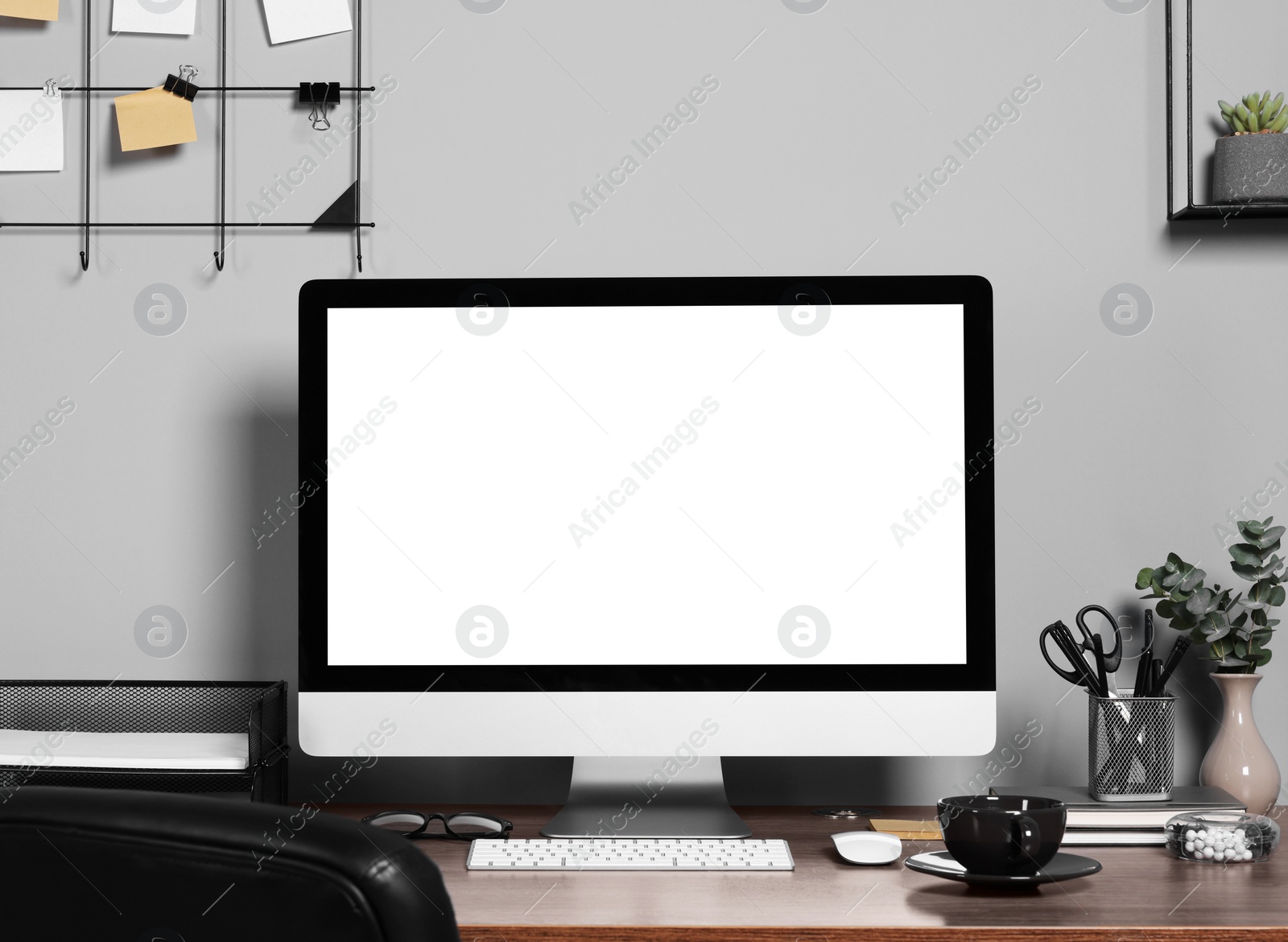 Photo of Cozy workspace with modern computer on wooden desk