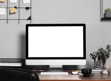 Photo of Cozy workspace with modern computer on wooden desk