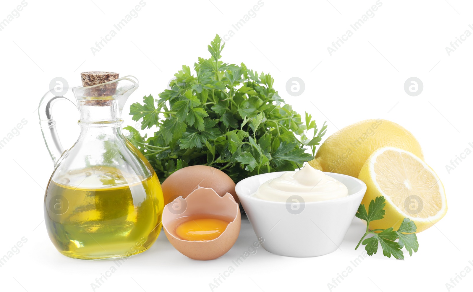 Photo of Tasty mayonnaise sauce in bowl and ingredients isolated on white