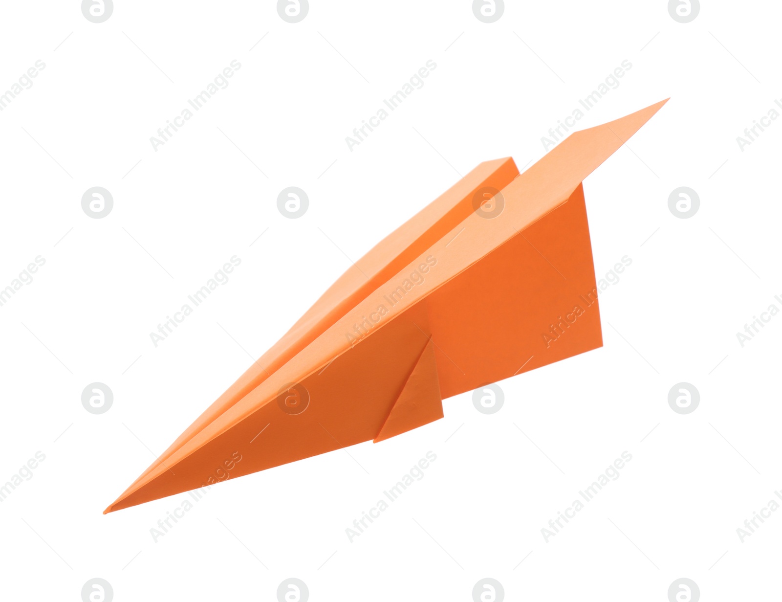 Photo of Handmade orange paper plane isolated on white