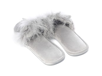 Pair of soft slippers with fur isolated on white