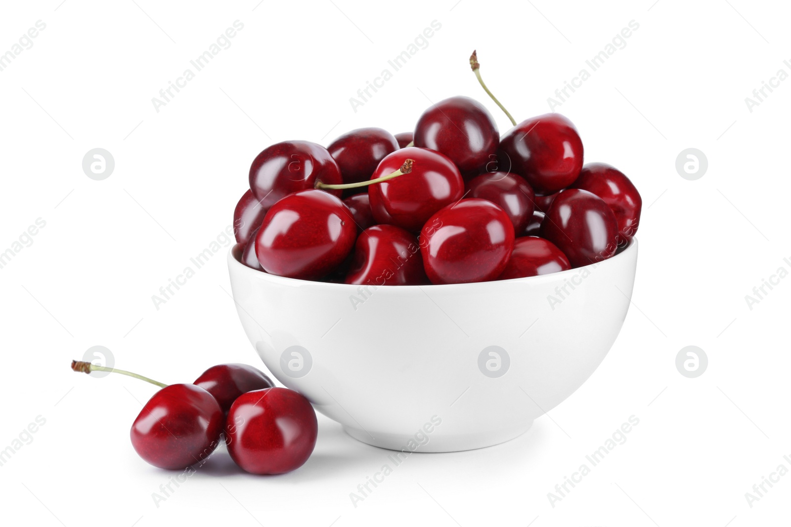 Photo of Tasty ripe red cherries and bowl isolated on white