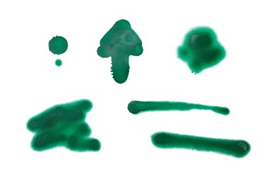 Symbols drawn by green spray paint on white background