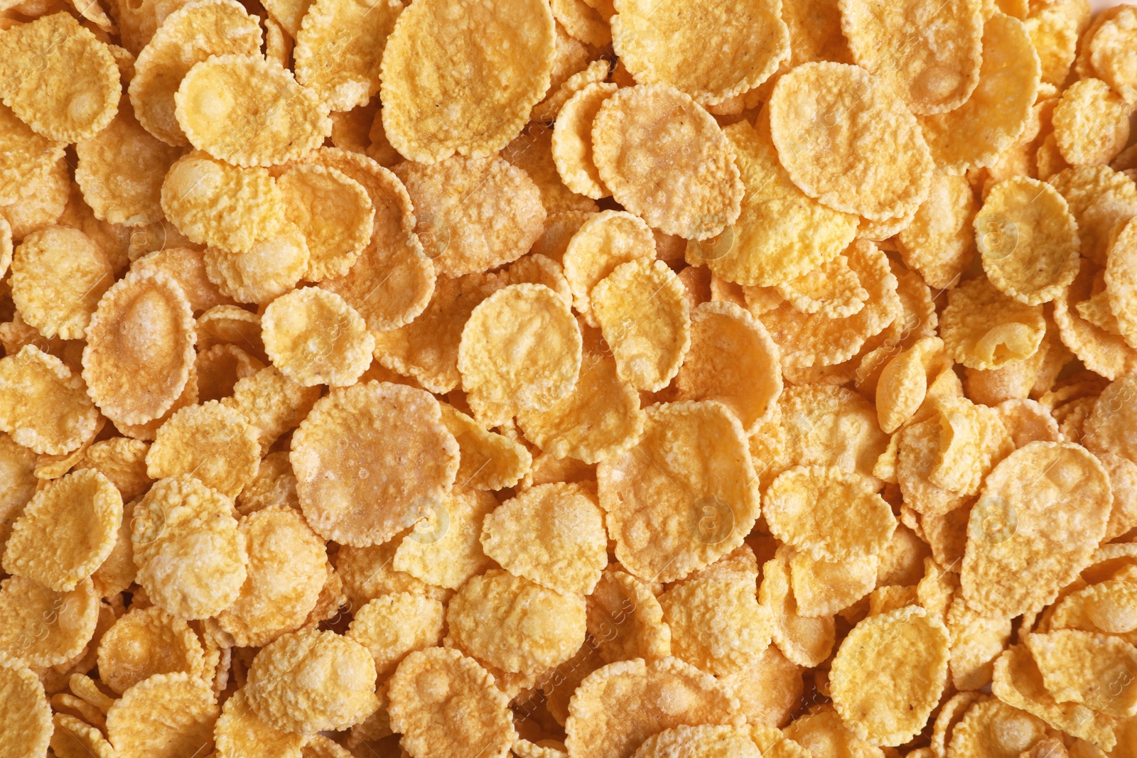 Photo of Crispy cornflakes as background, top view. Healthy breakfast