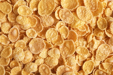 Photo of Crispy cornflakes as background, top view. Healthy breakfast
