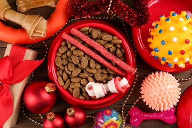 Flat lay composition with different pet shop goods on wooden background