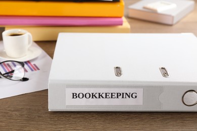 Photo of Bookkeeping folder on desk in office, closeup