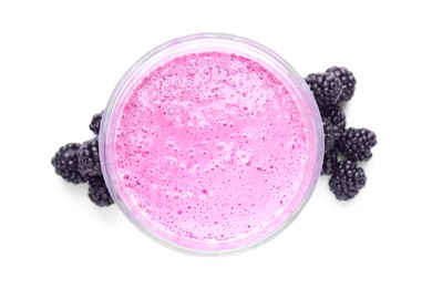 Photo of Glass of blackberry smoothie with berries on white background, top view