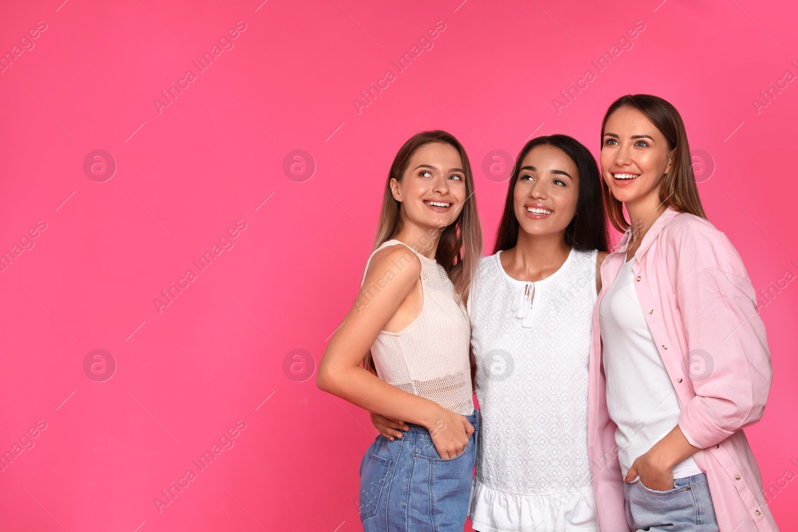 Photo of Happy women on pink background, space for text. Girl power concept