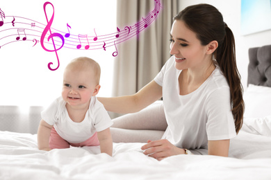 Flying music notes and little baby crawling near mother on bed indoors. Lullaby songs 