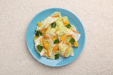 Tasty salad with Chinese cabbage on beige textured table, top view