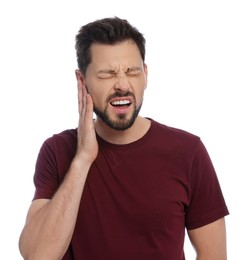 Photo of Man suffering from ear pain on white background