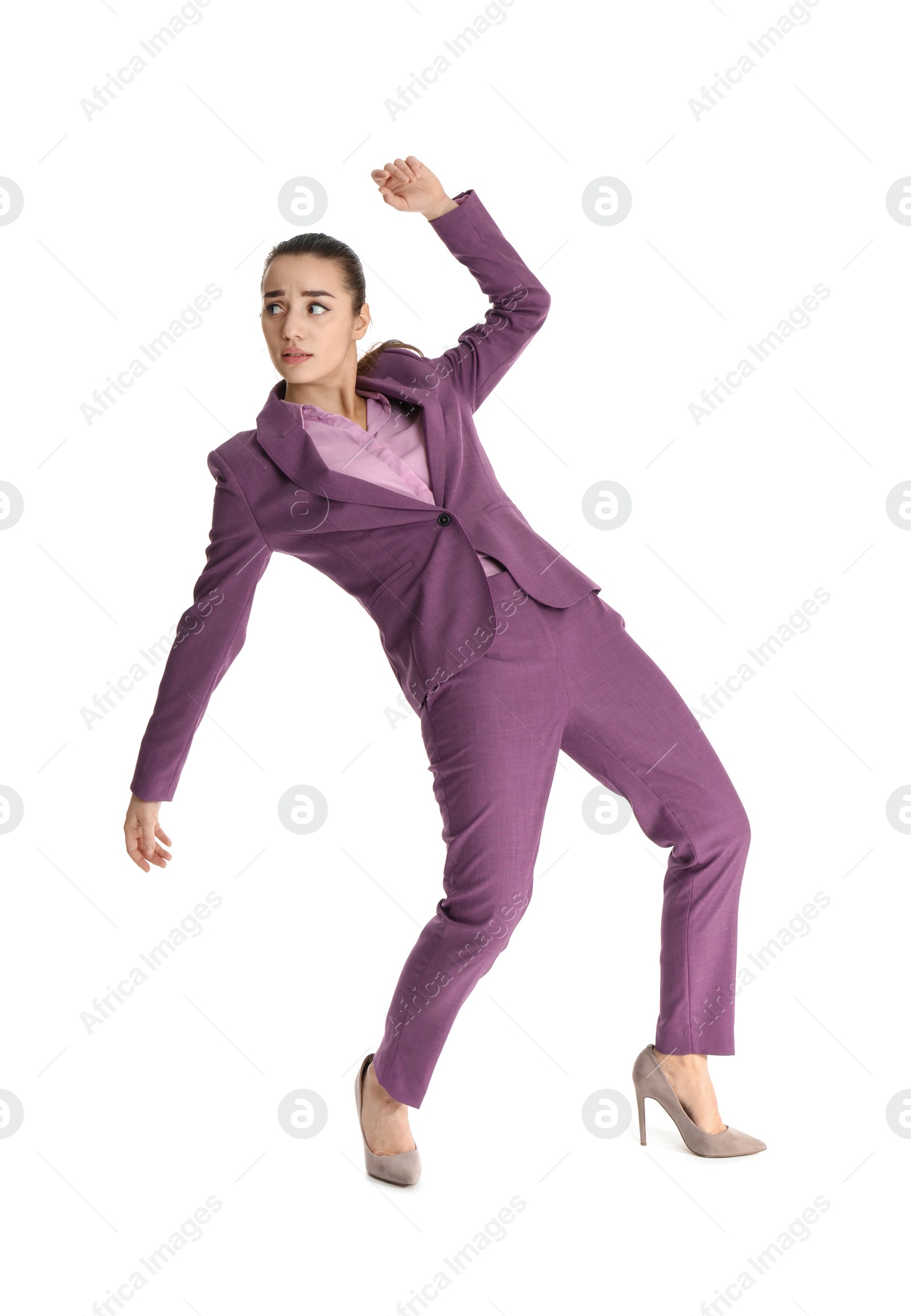 Photo of Businesswoman attracted to magnet on white background