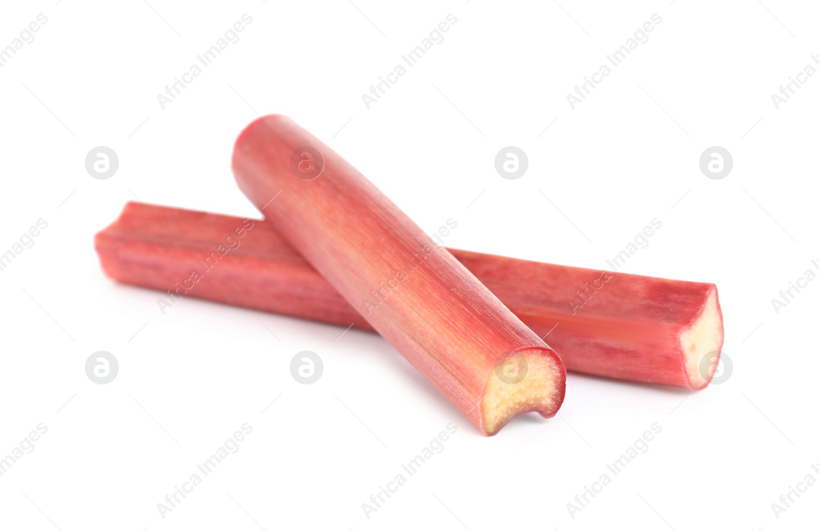 Photo of Fresh ripe rhubarb stalks isolated on white