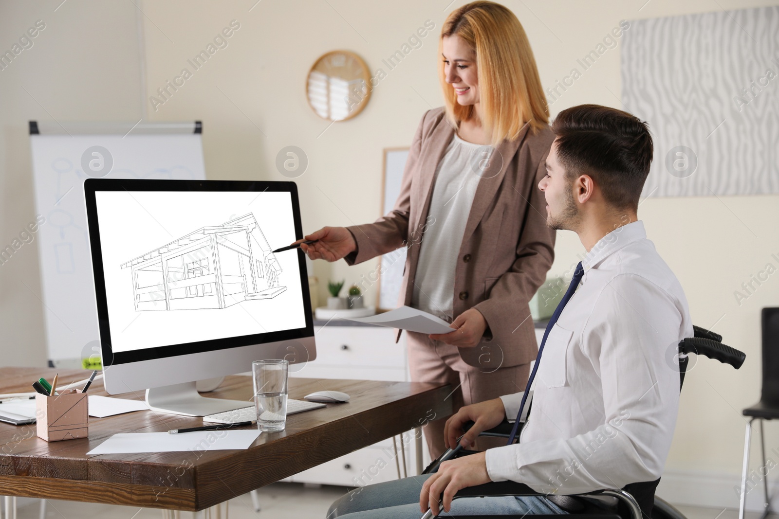 Image of Architects making project of house on computer in office