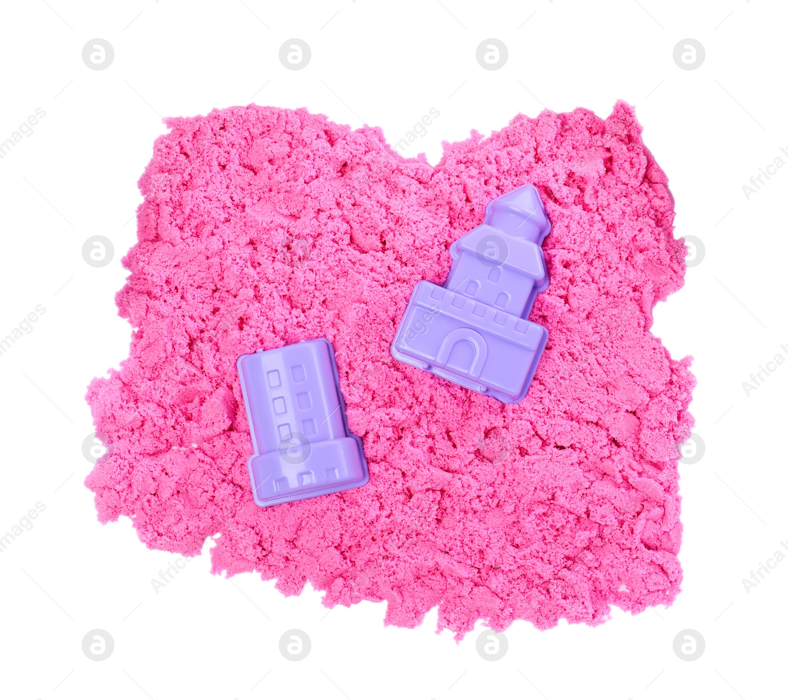 Photo of Pink kinetic sand and toys on white background, top view