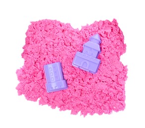 Pink kinetic sand and toys on white background, top view