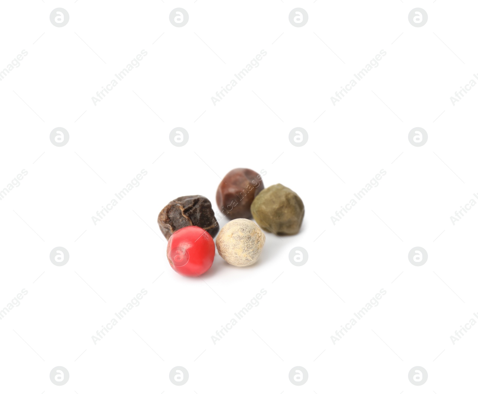 Photo of Mix of peppercorns isolated on white. Aromatic spice