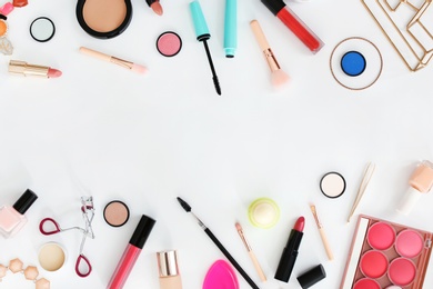 Flat lay composition with makeup products for woman on light background