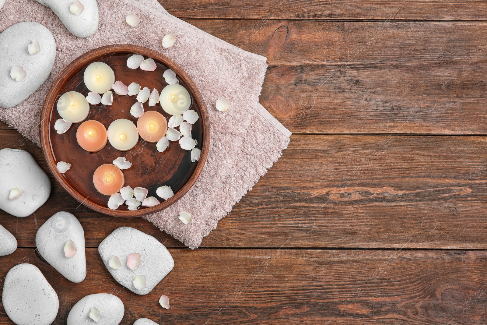 Photo of Flat lay composition with spa stones and space for text on wooden background