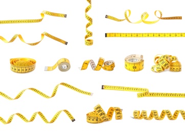 Image of Set of yellow measuring tapes on white background