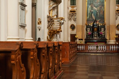 Photo of Beautiful church interior with ecclesiastical icons and wooden benches