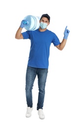 Courier in face mask with bottle of cooler water on white background. Delivery during coronavirus quarantine