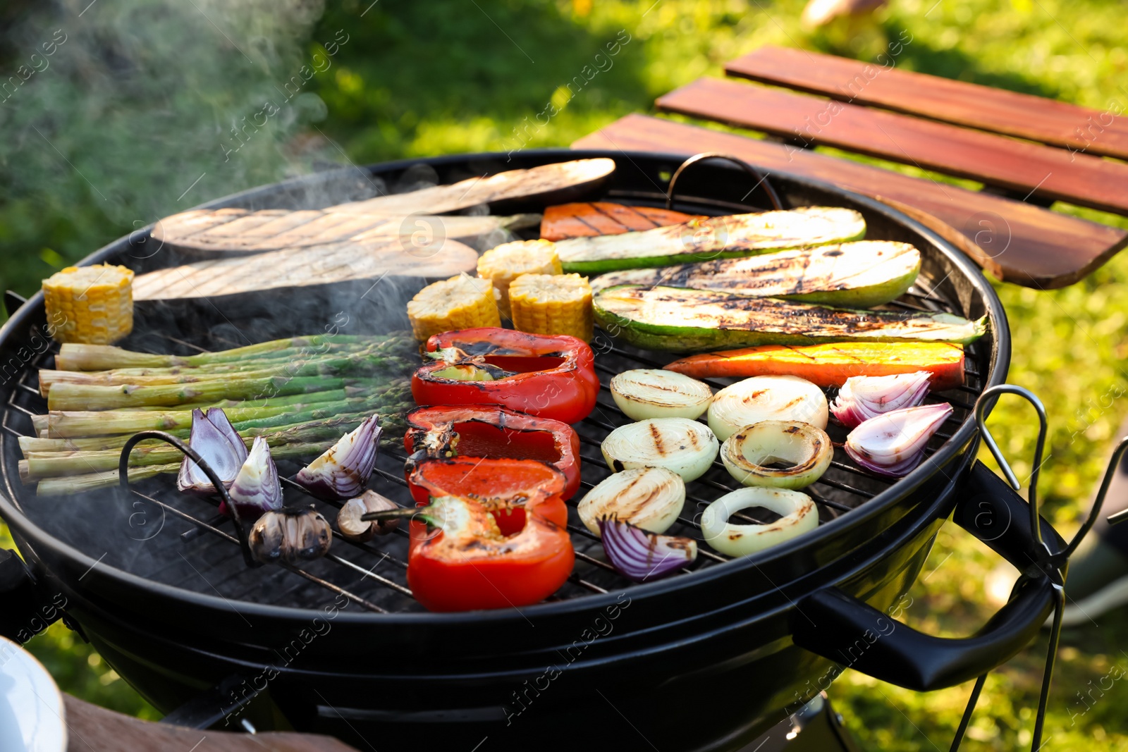 Photo of Delicious grilled vegetables on barbecue grill outdoors