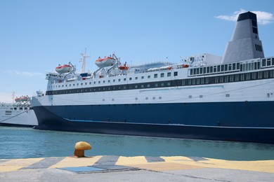 Modern ferry in sea port on sunny day