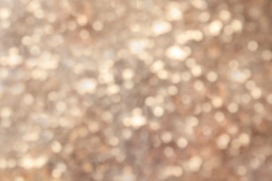 Photo of Blurred view of color glitter as background