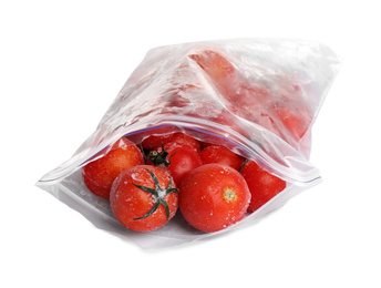 Photo of Frozen tomatoes in plastic bag isolated on white. Vegetable preservation
