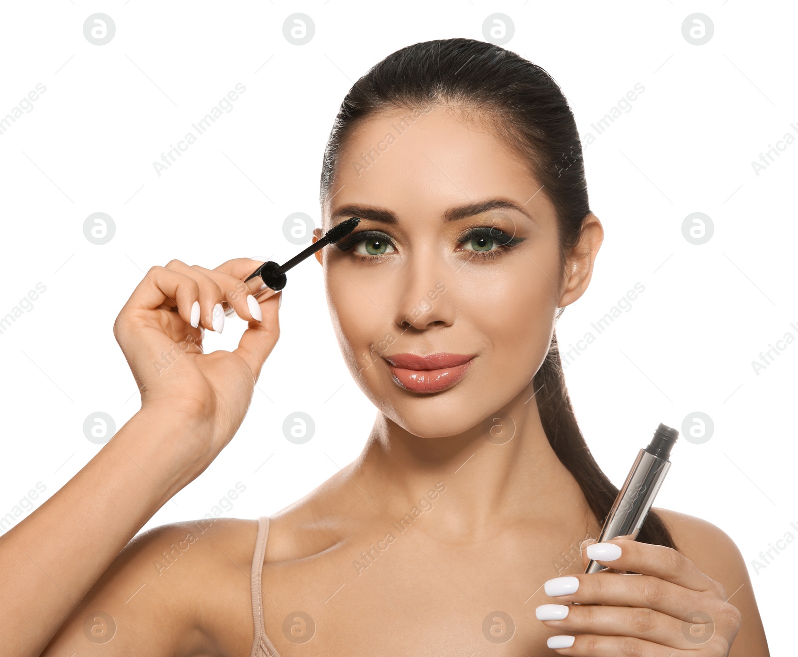 Photo of Beautiful woman applying mascara on white background. Stylish makeup